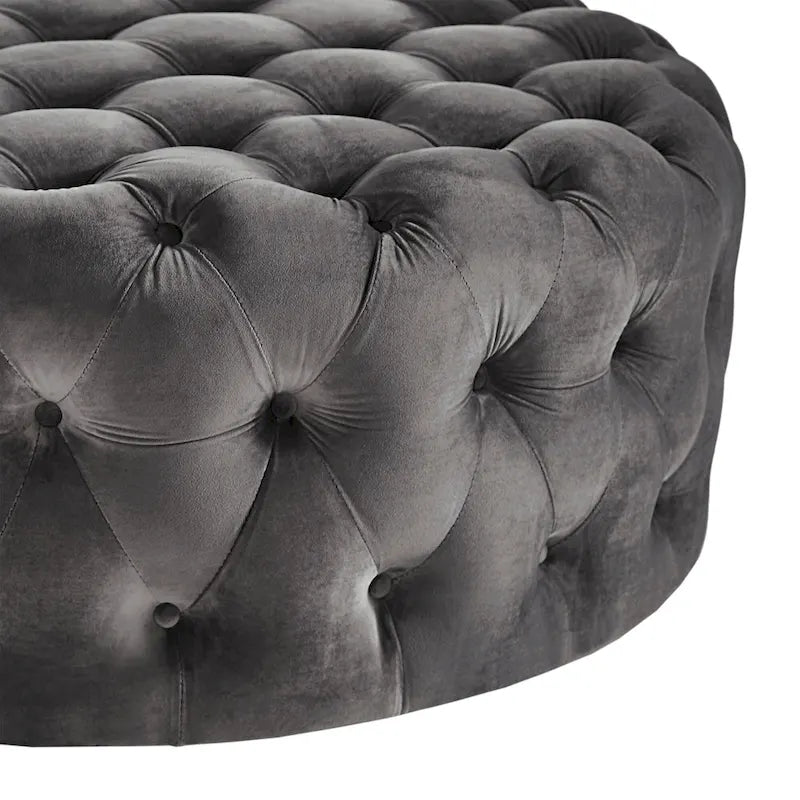 Pouf rotondo trapuntato con rotelle