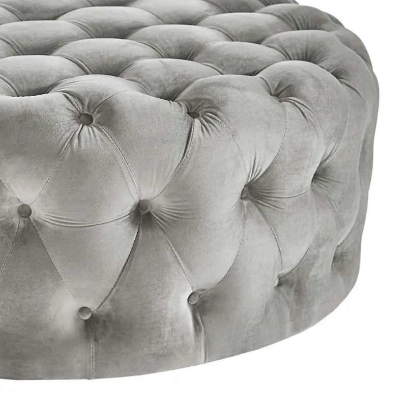 Pouf rotondo trapuntato con rotelle