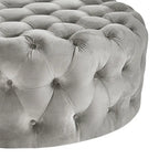 Pouf rotondo trapuntato con rotelle